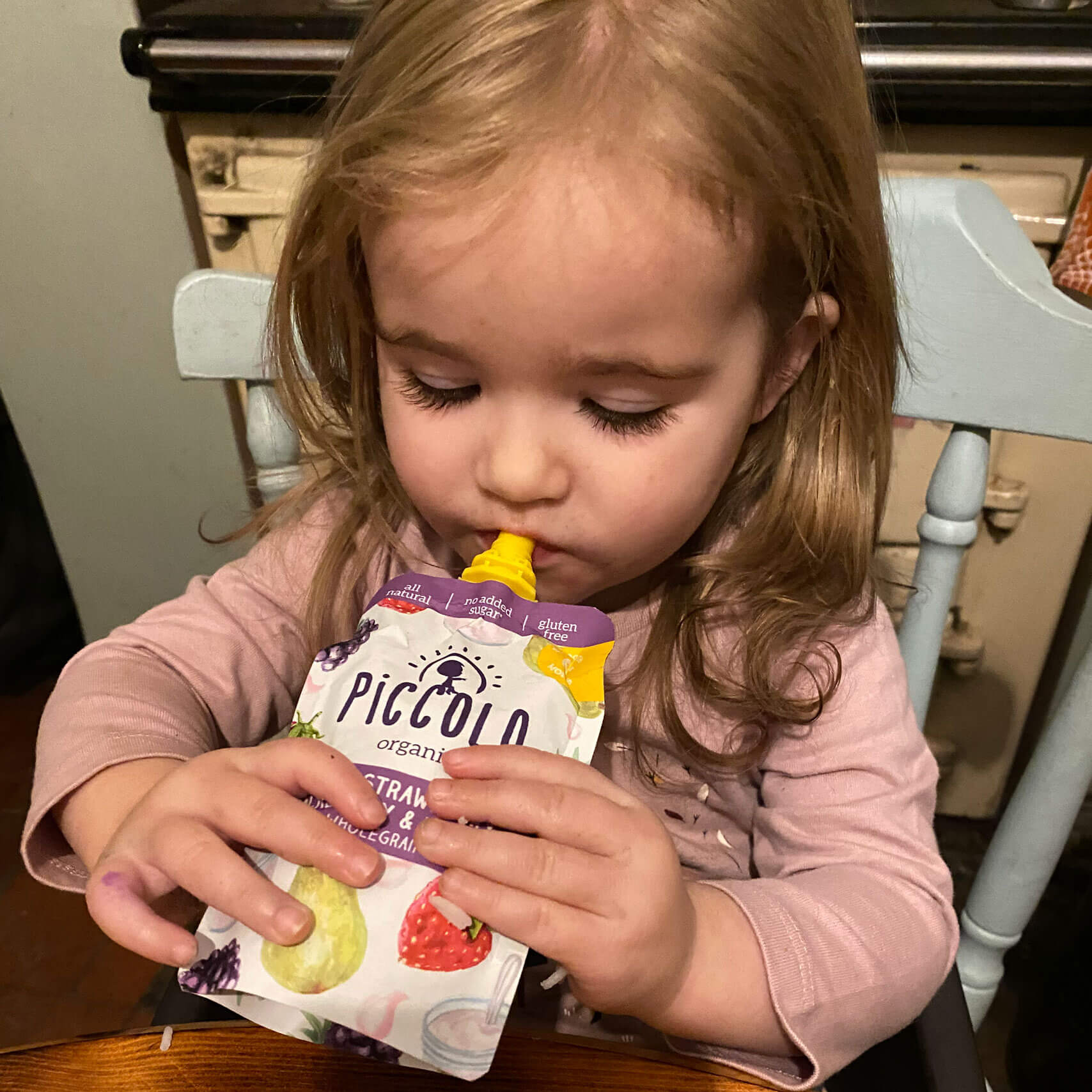 Imogen enjoying her Piccolo pouch!