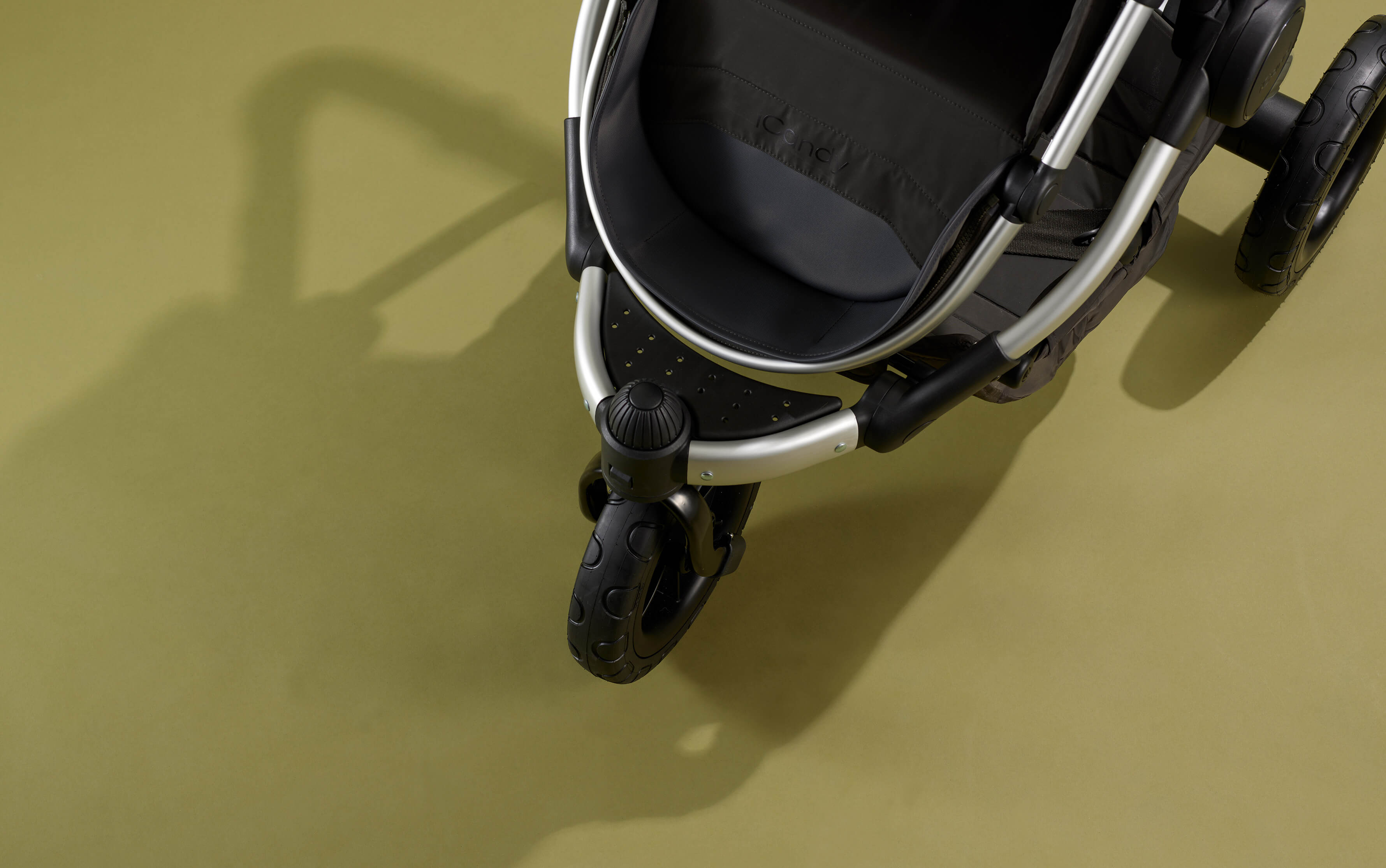 What is a three-wheel pushchair?